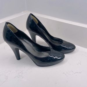 Black heels; crocodile print  (size 8)